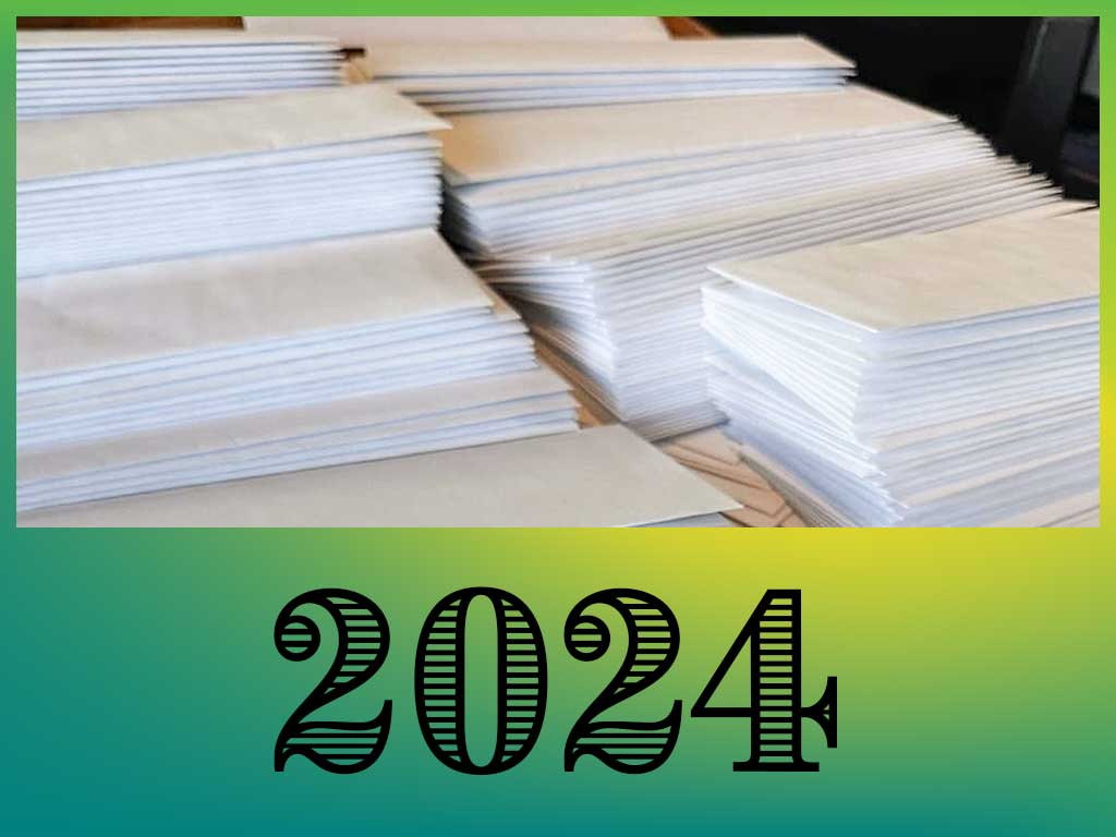 Envelopes prepared to share 2024 news with donors